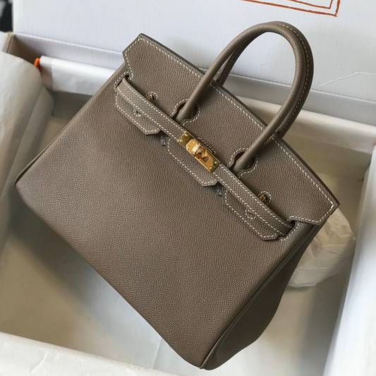 Muted Elephant Grey Fine Crosshatch Grain Structured Hand Tote With Contrast Light Stitching, Polished Golden Twist Lock Hardware And Dual Curved Top Carry Grips