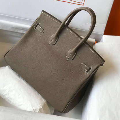 Muted Elephant Grey Fine Crosshatch Grain Structured Hand Tote With Contrast Light Stitching, Polished Golden Twist Lock Hardware And Dual Curved Top Carry Grips